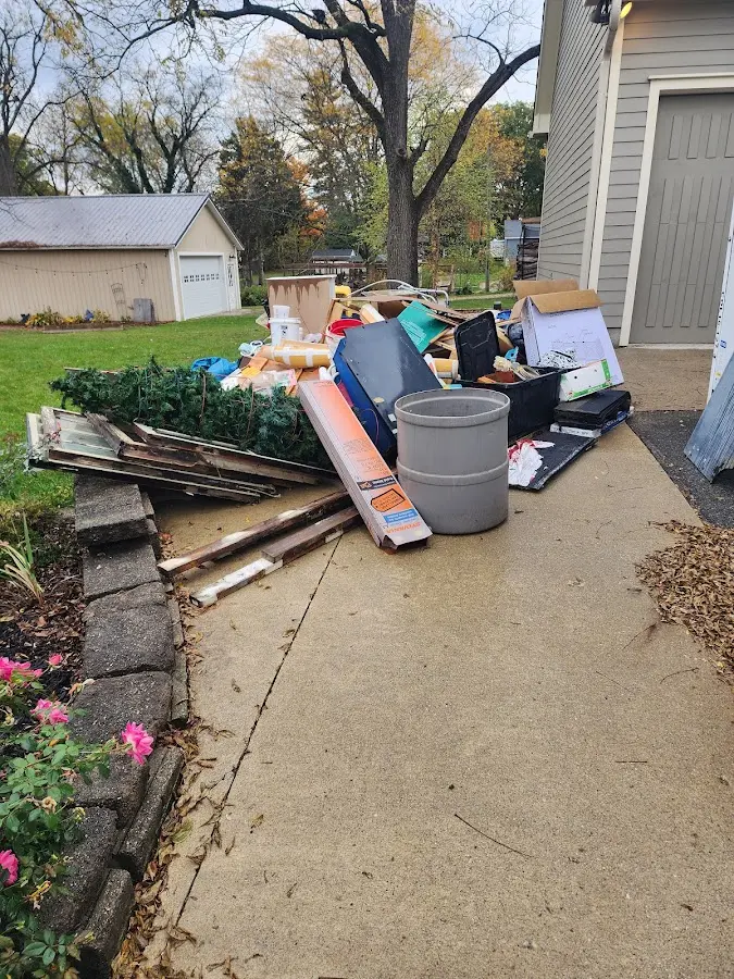 Dumpster being loaded with debris for Residential Dumpster Rental in Richfield